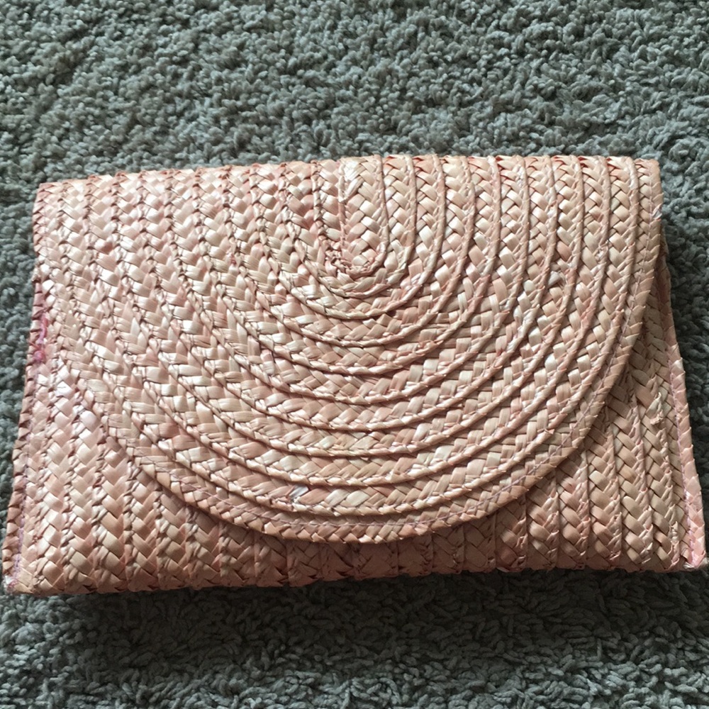 Coral woven clutch